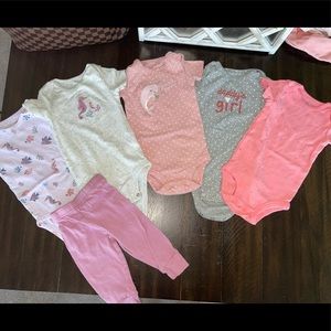 Baby girl 5 onesies and 1 pair of pants (all 9 month)